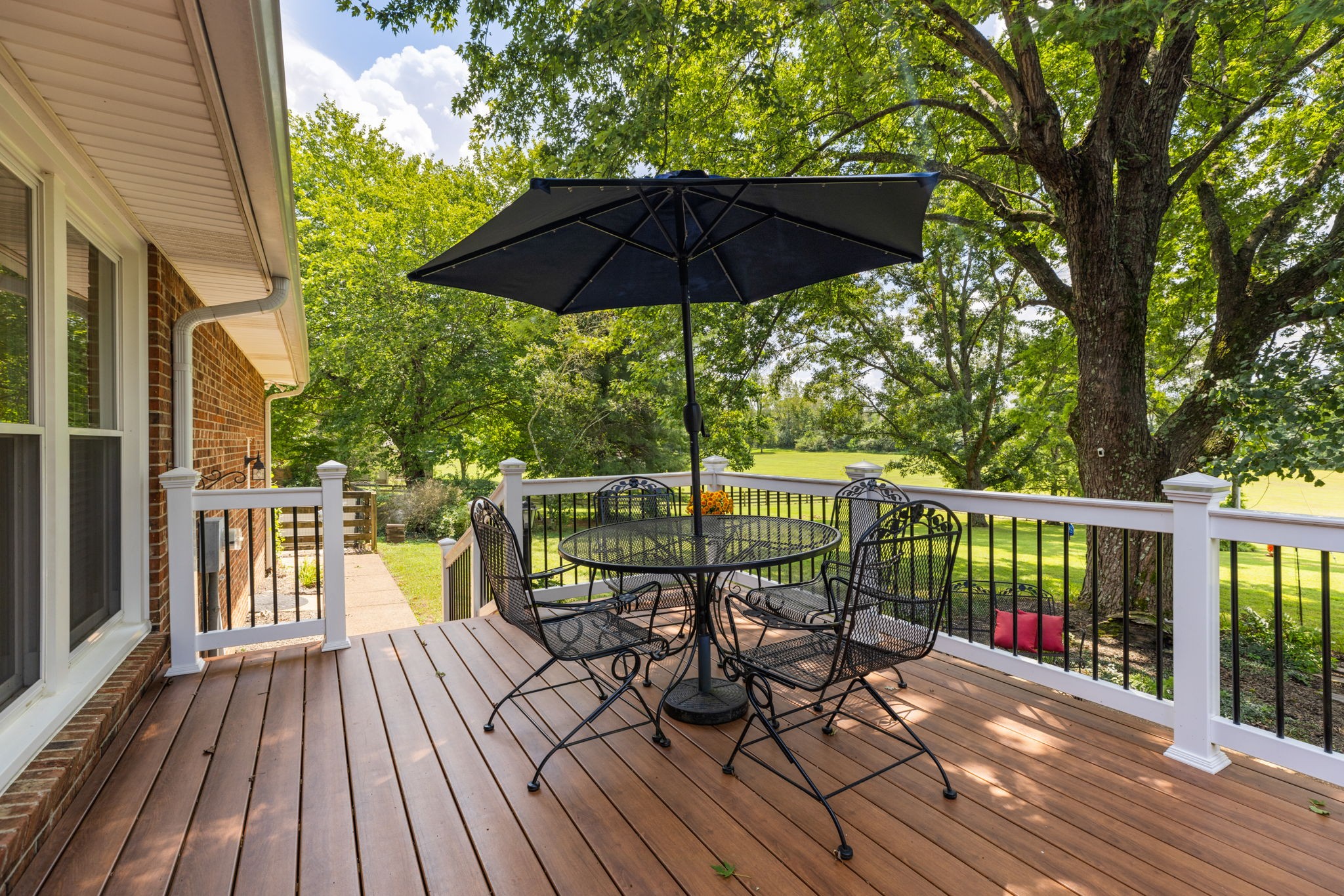 7367 Crow Cut Road Fairview, TN 37062 - Photo 58 of 96 a view of balcony with outdoor seating and wooden floor