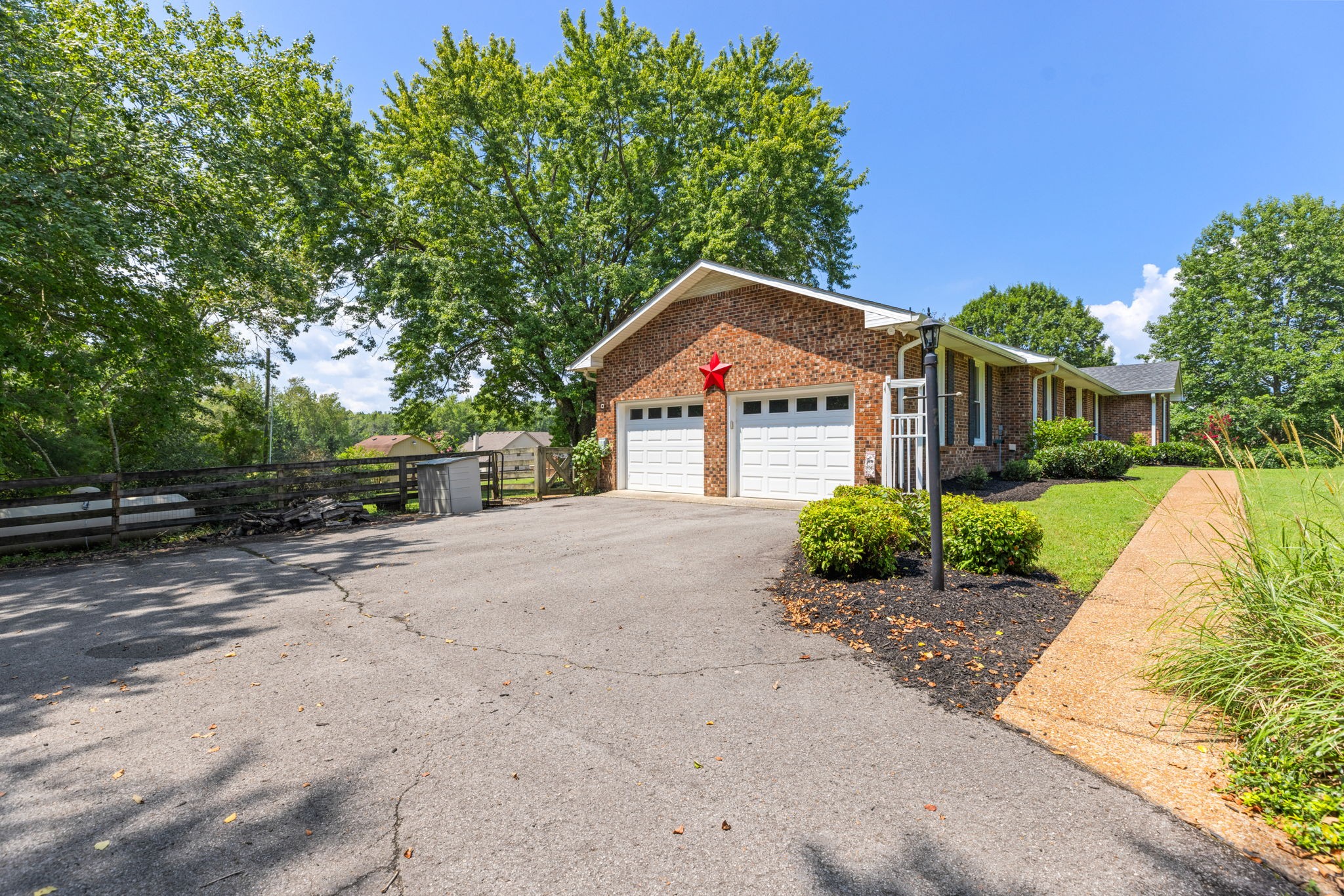 7367 Crow Cut Road Fairview, TN 37062 - Photo 62 of 96 a front view of a house with a yard and garage