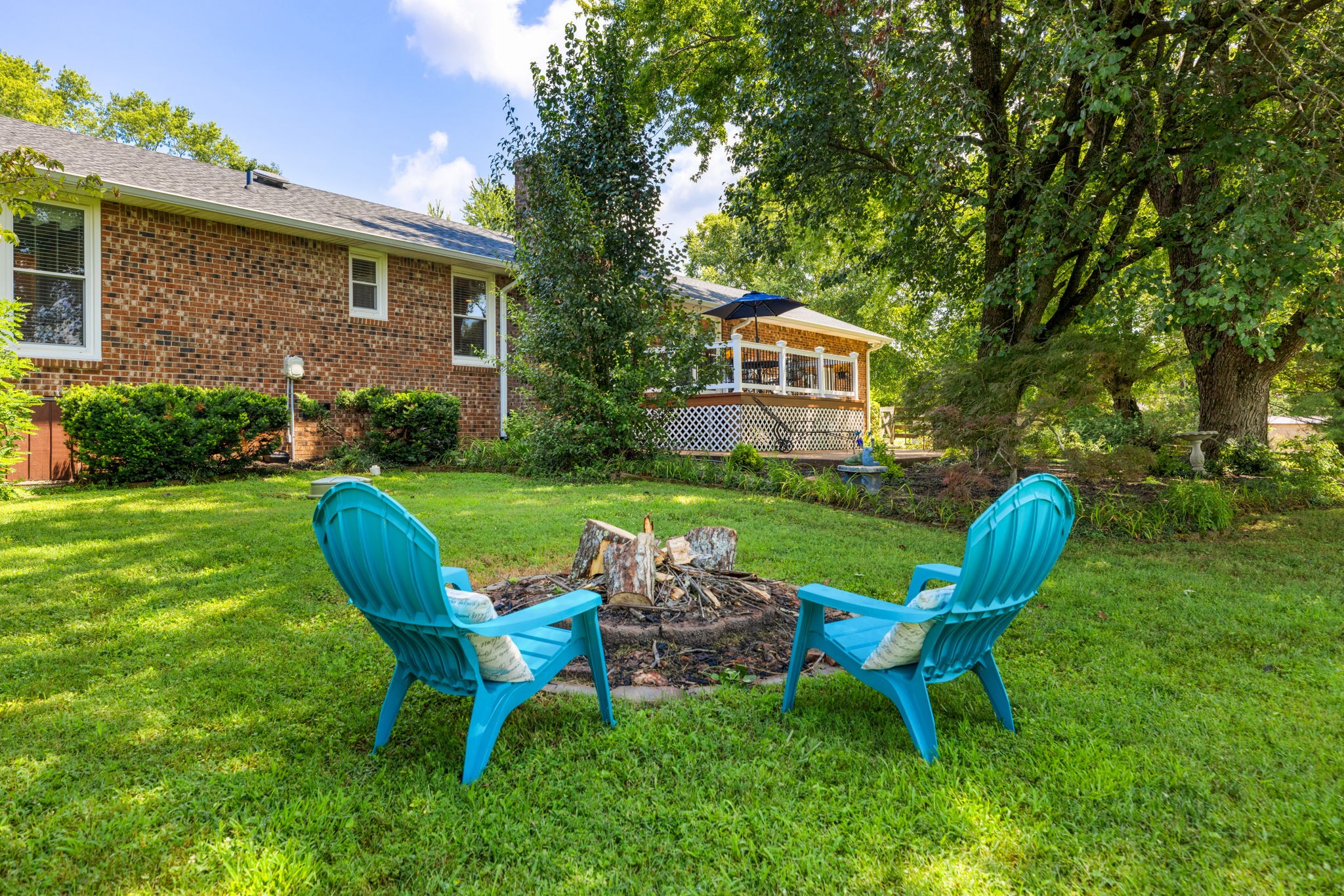 7367 Crow Cut Road Fairview, TN 37062 - Photo 66 of 96 a view of a chair and table in backyard of the house