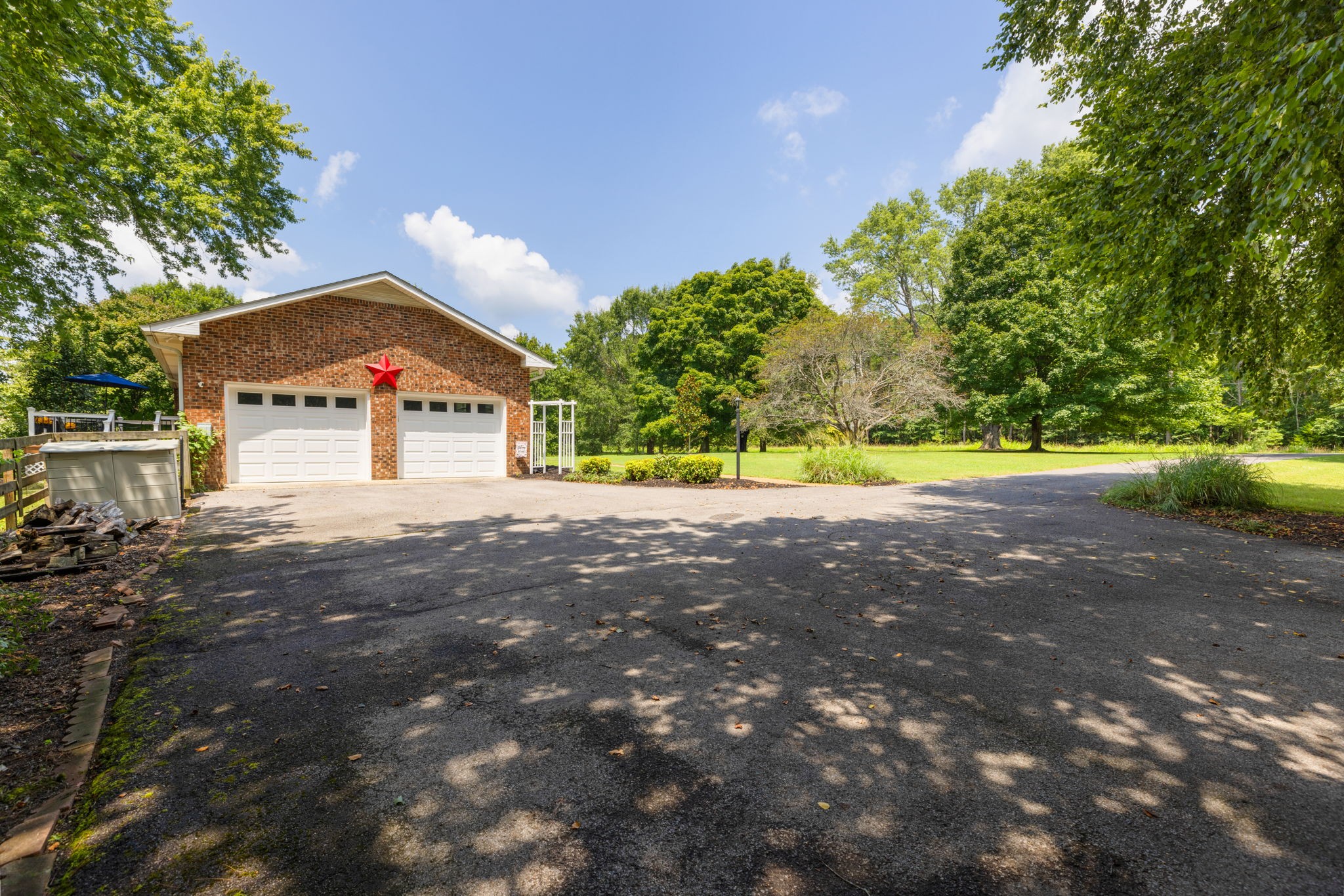 7367 Crow Cut Road Fairview, TN 37062 - Photo 85 of 96 a front view of a house with a yard and garage