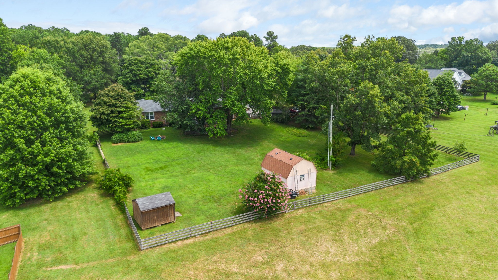 7367 Crow Cut Road Fairview, TN 37062 - Photo 93 of 96 a view of a backyard with table and chairs and potted plants