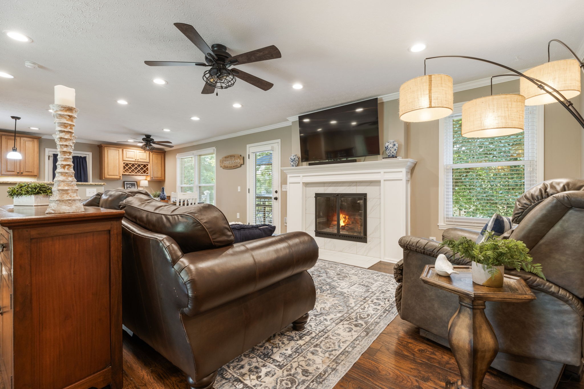 7367 Crow Cut Road Fairview, TN 37062 - Photo 10 of 96 a living room with furniture fireplace and a flat screen tv