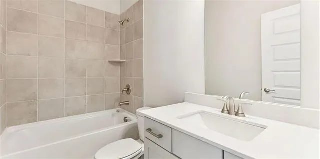 a bathroom with a sink toilet and bathtub