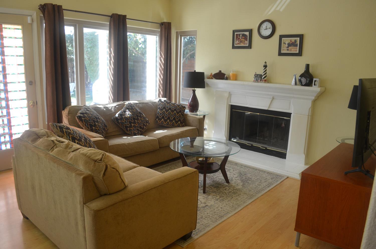 8392 Red Fox Way Elk Grove, CA 95758 - Photo 12 of 30 a living room with furniture and a fireplace