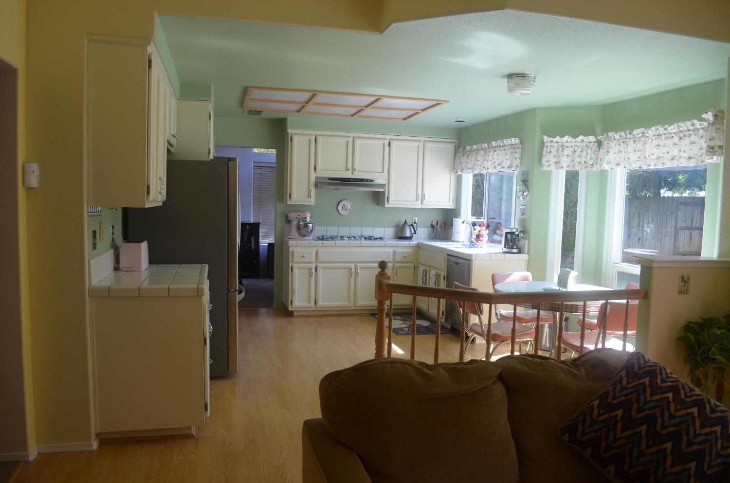 8392 Red Fox Way Elk Grove, CA 95758 - Photo 14 of 30 a dining room with furniture a window and kitchen view