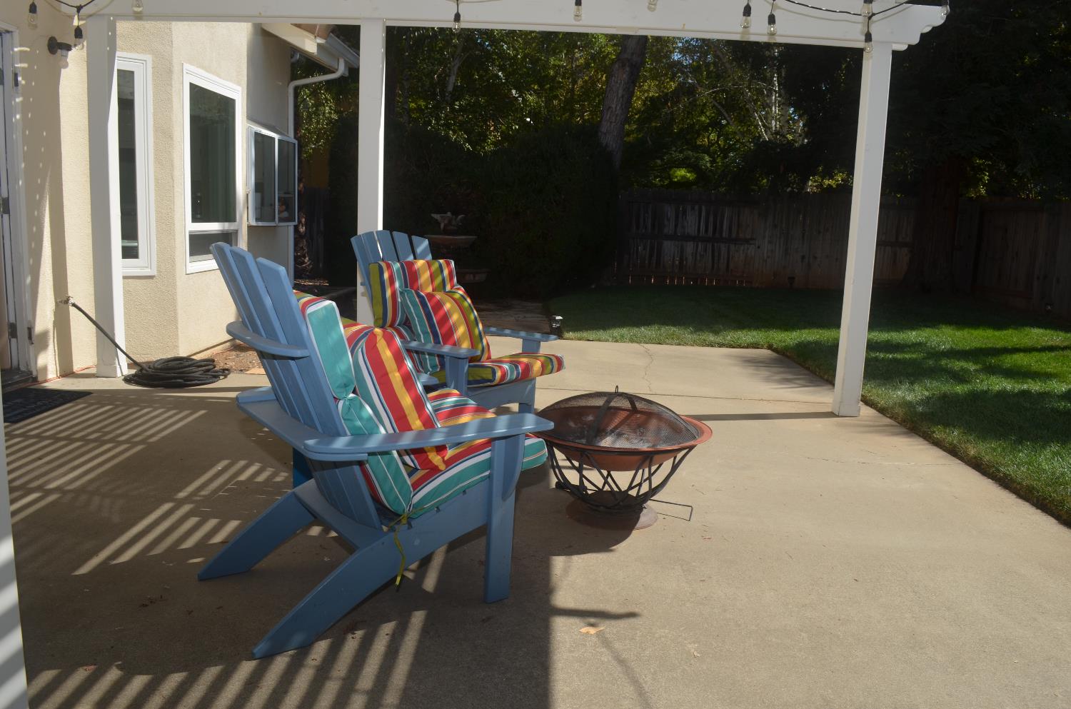 8392 Red Fox Way Elk Grove, CA 95758 - Photo 16 of 30 a backyard of a house with barbeque oven and outdoor seating