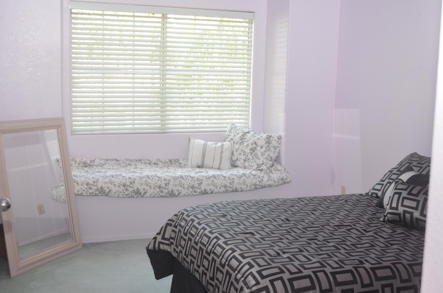 8392 Red Fox Way Elk Grove, CA 95758 - Photo 21 of 30 a bathroom with a bathtub and next to a window
