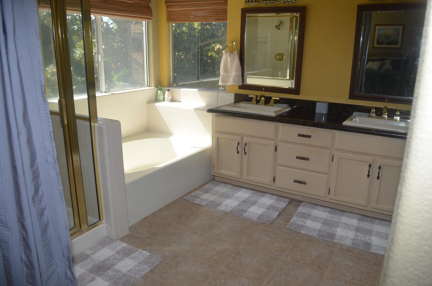 8392 Red Fox Way Elk Grove, CA 95758 - Photo 29 of 30 a bathroom with a granite countertop sink and a mirror