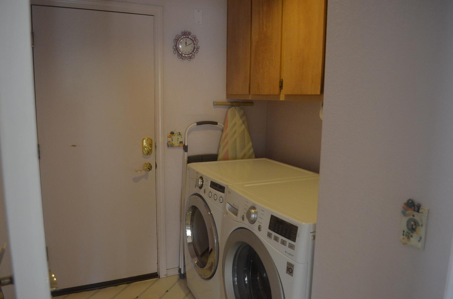 8392 Red Fox Way Elk Grove, CA 95758 - Photo 9 of 30 a utility room with dryer and washer