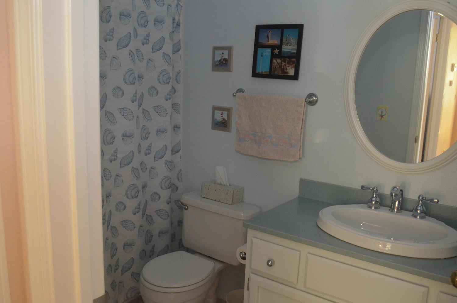 8392 Red Fox Way Elk Grove, CA 95758 - Photo 10 of 30 a bathroom with a granite countertop toilet sink and mirror