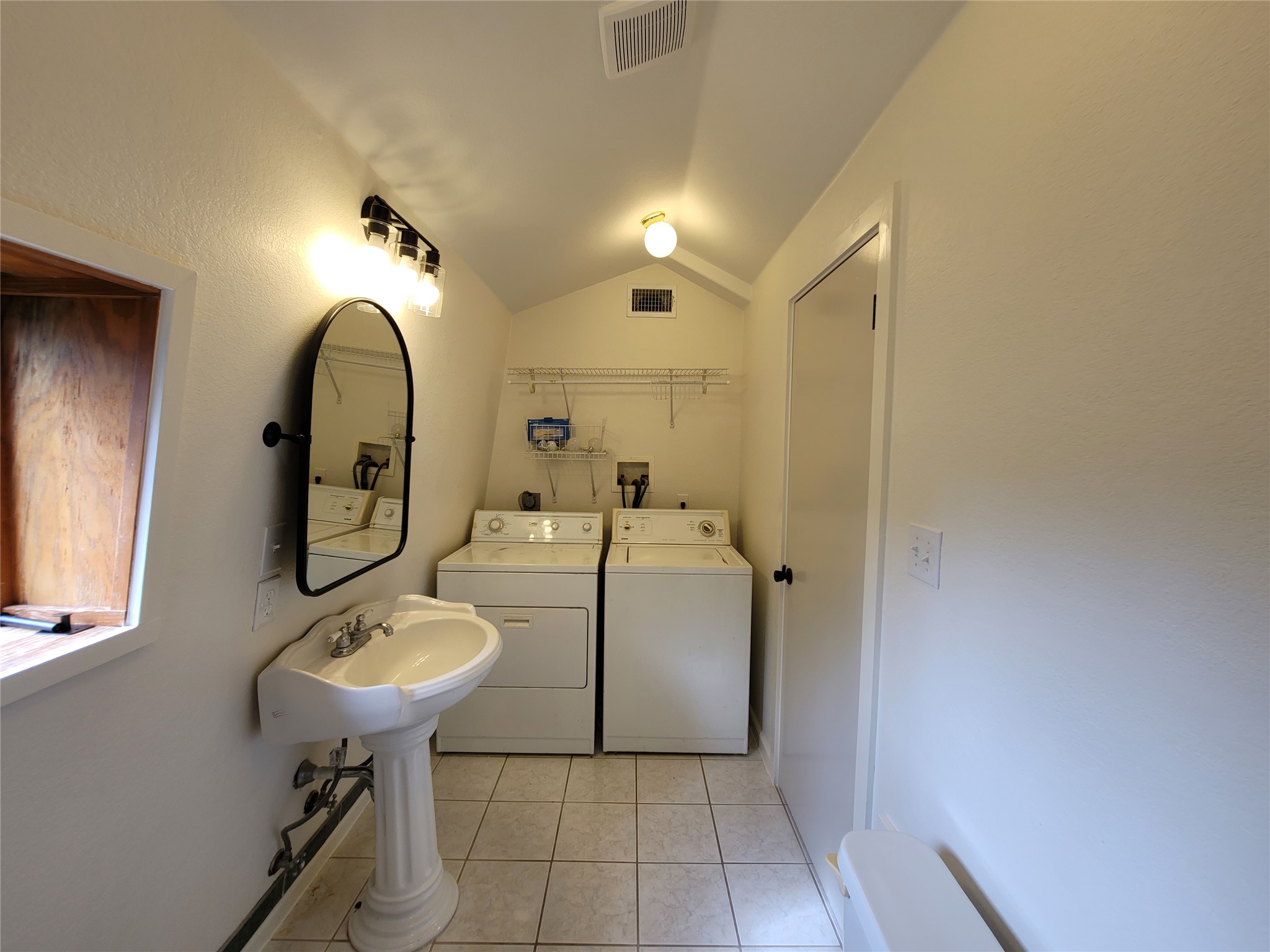 281 Earl Callahan Road, Unit A Cedar Creek, TX 78612 - Photo 31 of 39 a bathroom with a sink a mirror and a shower