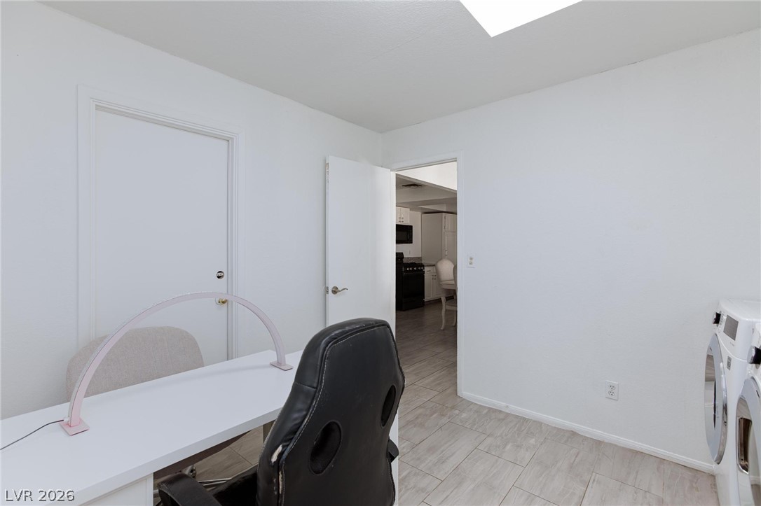 3640 North Walnut Road Las Vegas, NV 89115 - Photo 23 of 38 A well-appointed utility room featuring sleek flooring and convenient access to adjacent spaces.