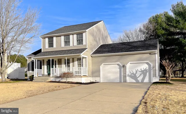a front view of a house with parking