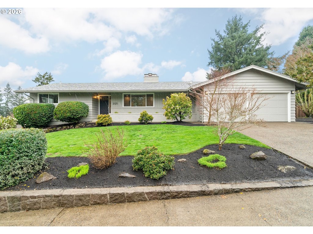 2125 Southwest Warwick Avenue Portland, OR 97225 - Photo 1 of 40 a front view of a house with a yard