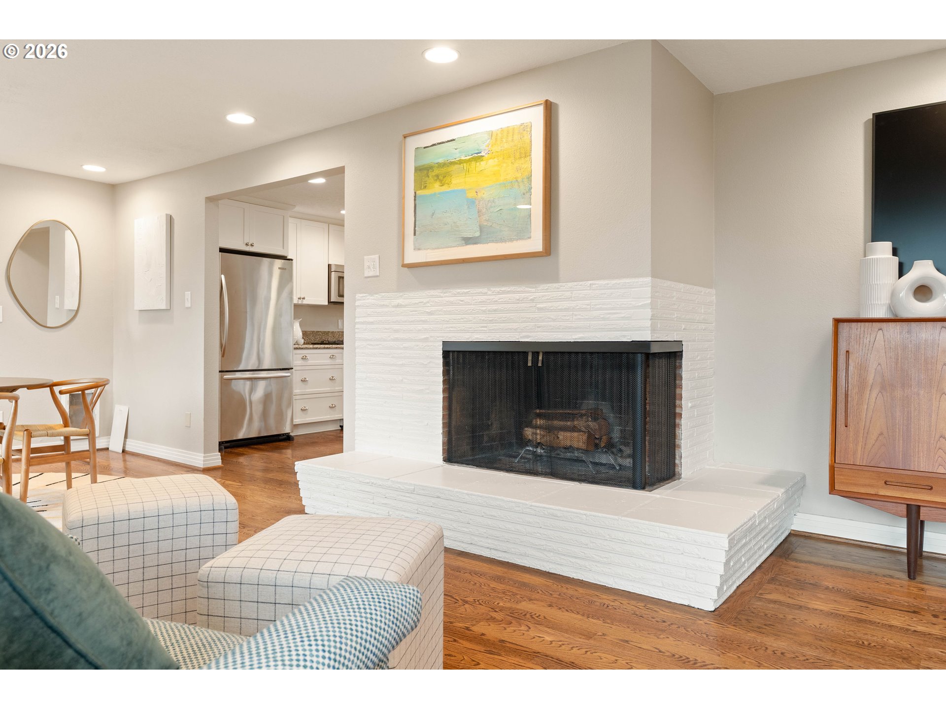 2125 Southwest Warwick Avenue Portland, OR 97225 - Photo 12 of 40 a living room with furniture and a fireplace