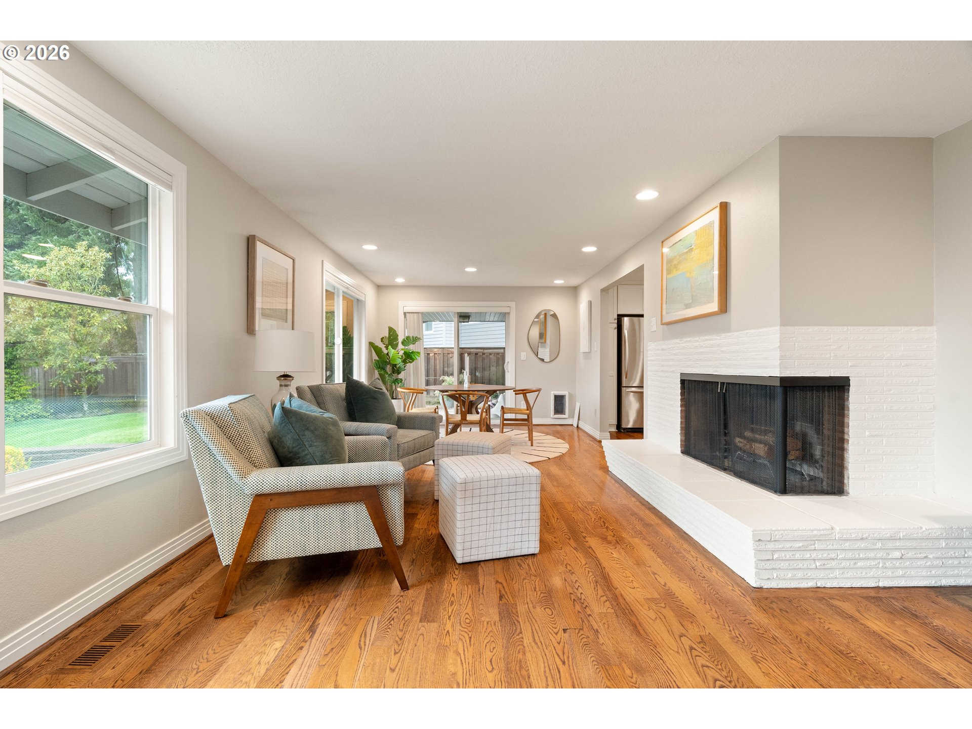 2125 Southwest Warwick Avenue Portland, OR 97225 - Photo 13 of 40 a living room with furniture and a fireplace