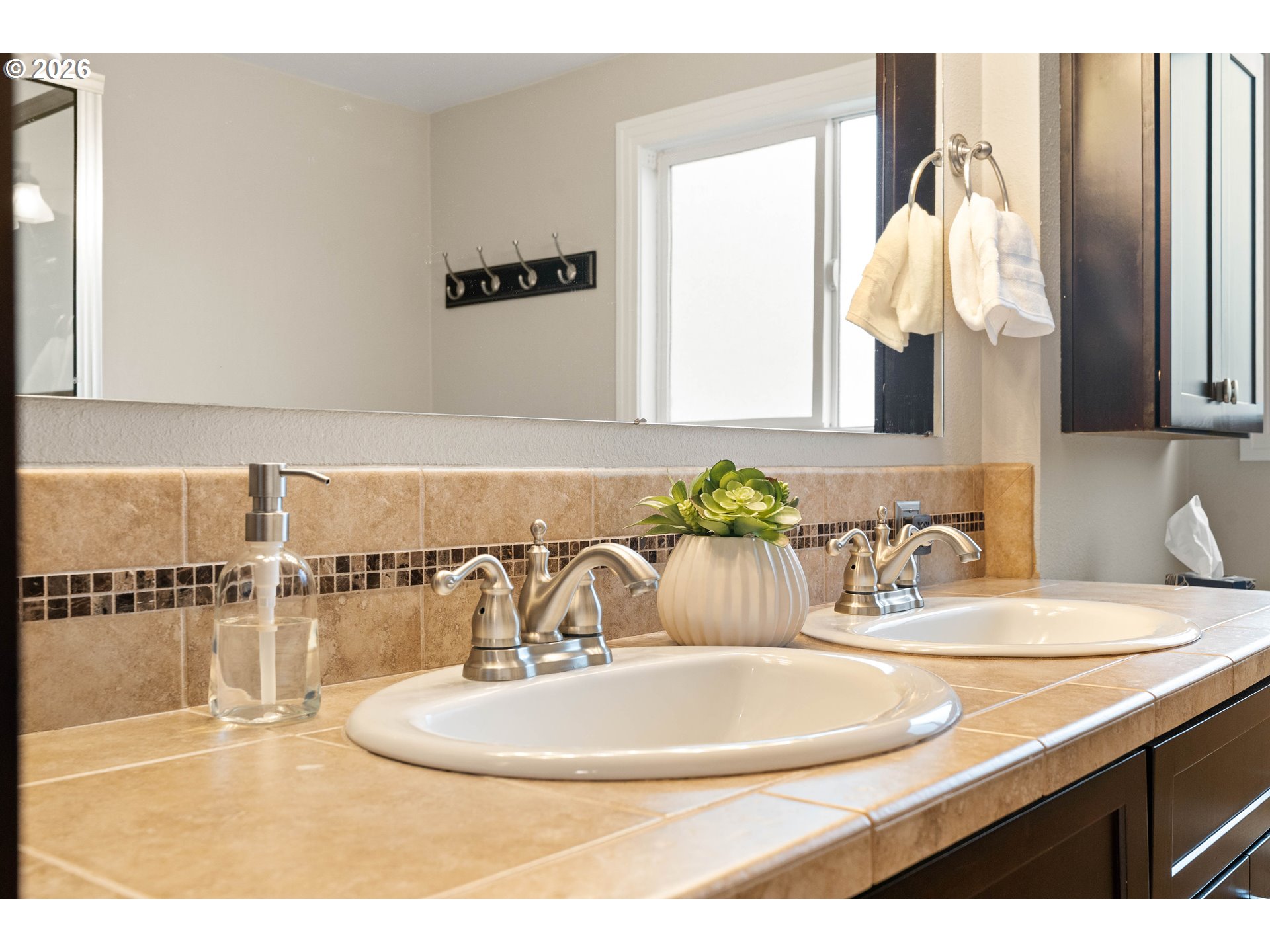 2125 Southwest Warwick Avenue Portland, OR 97225 - Photo 19 of 40 a bathroom with a sink and a mirror