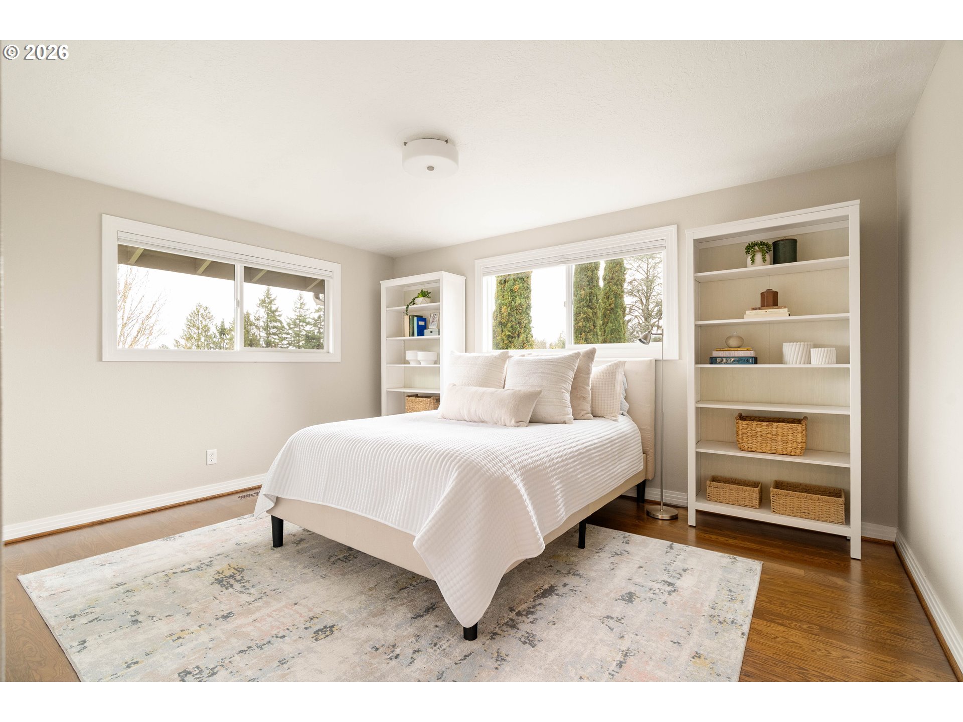 2125 Southwest Warwick Avenue Portland, OR 97225 - Photo 21 of 40 a bedroom with a bed and a window