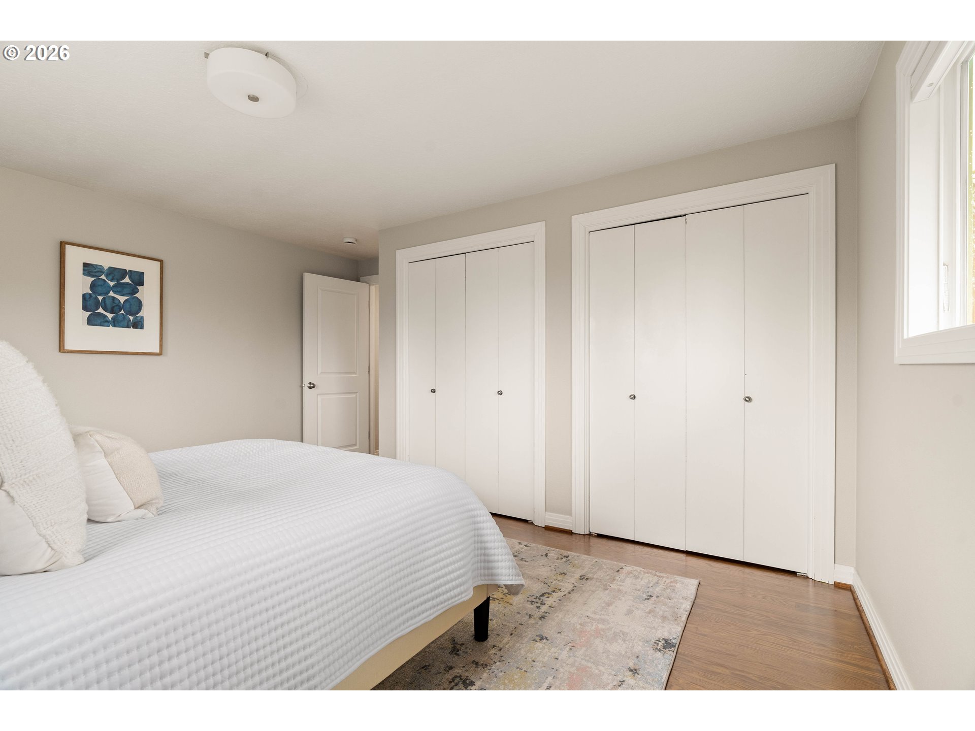2125 Southwest Warwick Avenue Portland, OR 97225 - Photo 22 of 40 a large white bed in a white room