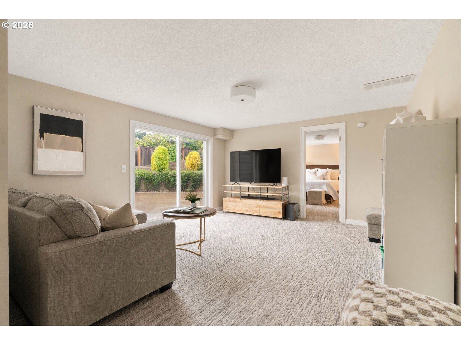 2125 Southwest Warwick Avenue Portland, OR 97225 - Photo 23 of 40 a living room with furniture and a flat screen tv
