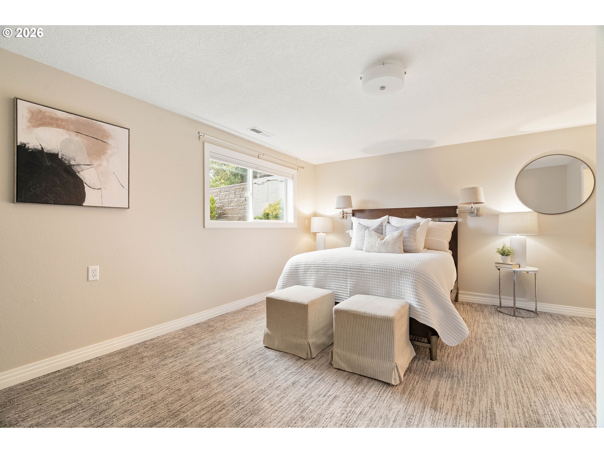 2125 Southwest Warwick Avenue Portland, OR 97225 - Photo 24 of 40 a bedroom with a bed and night stand