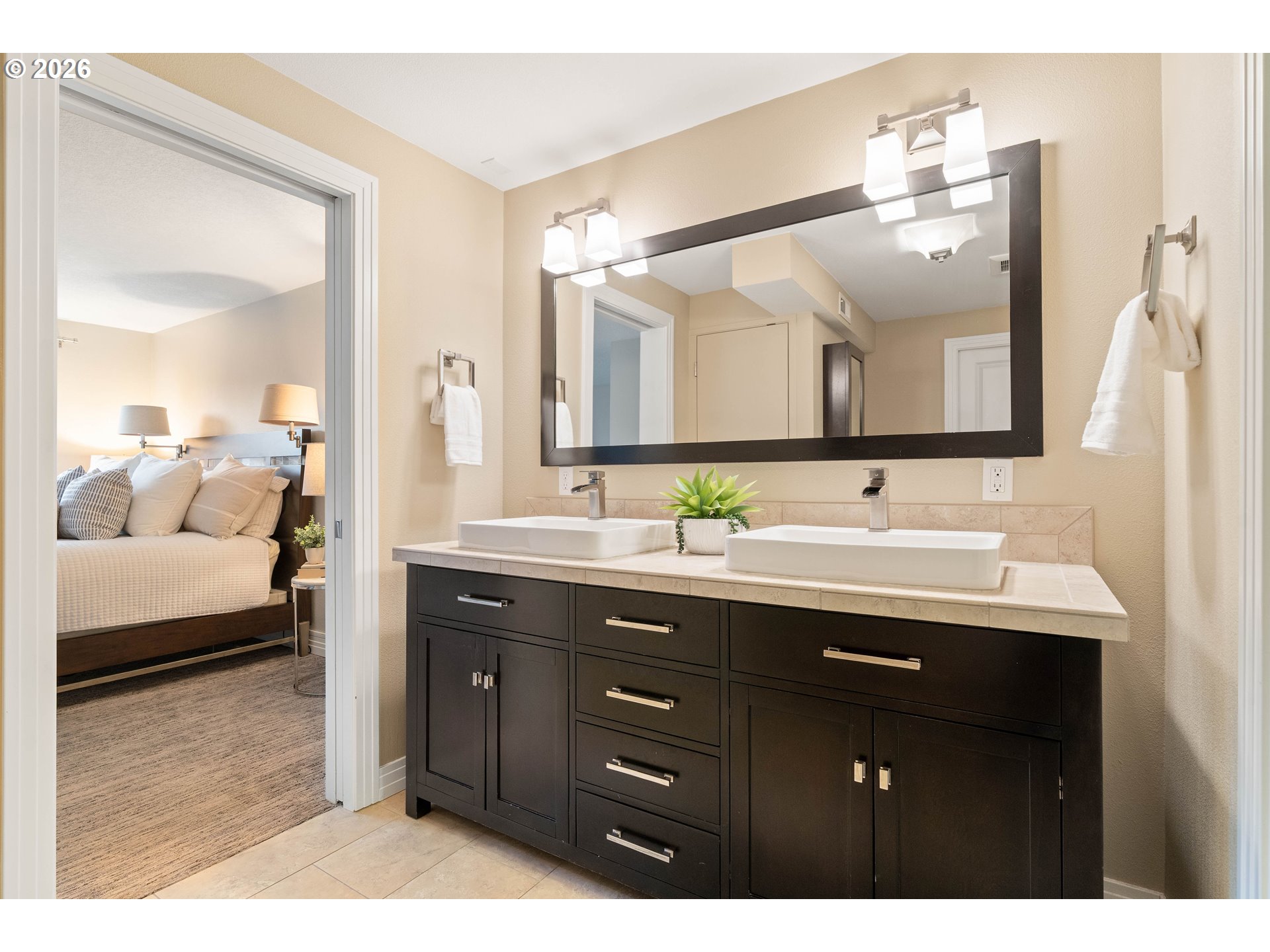2125 Southwest Warwick Avenue Portland, OR 97225 - Photo 27 of 40 a en suite bathroom with double vanity and a mirror