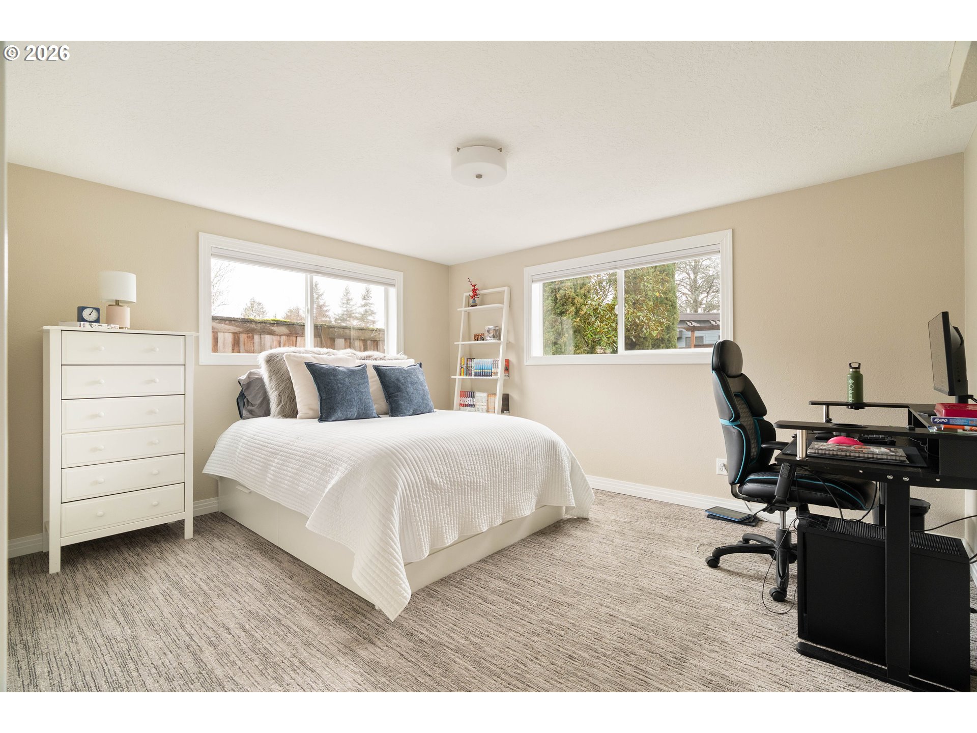 2125 Southwest Warwick Avenue Portland, OR 97225 - Photo 33 of 40 a bedroom with a bed and a desk
