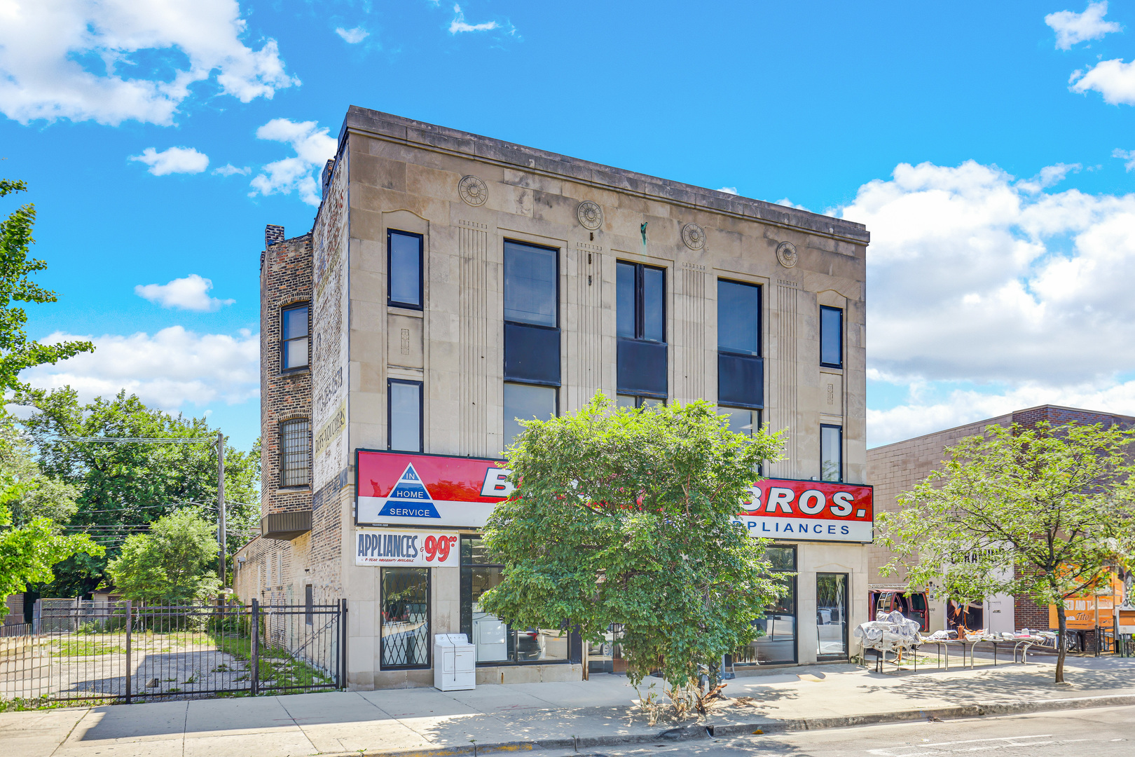 4231 West Madison Street Chicago, IL 60624 - Photo 4 of 19 a front view of multi story residential apartment building with yard