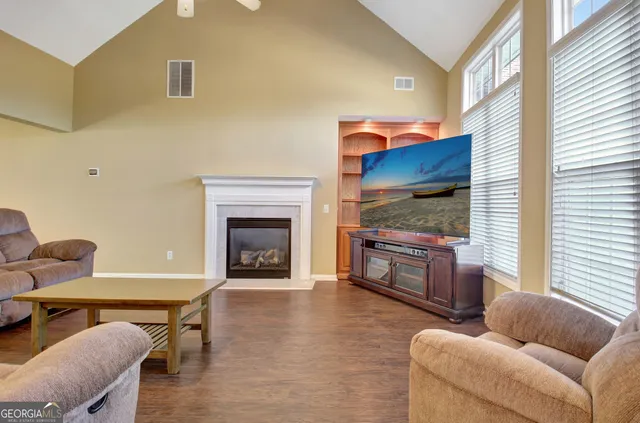 a living room with furniture and a fireplace