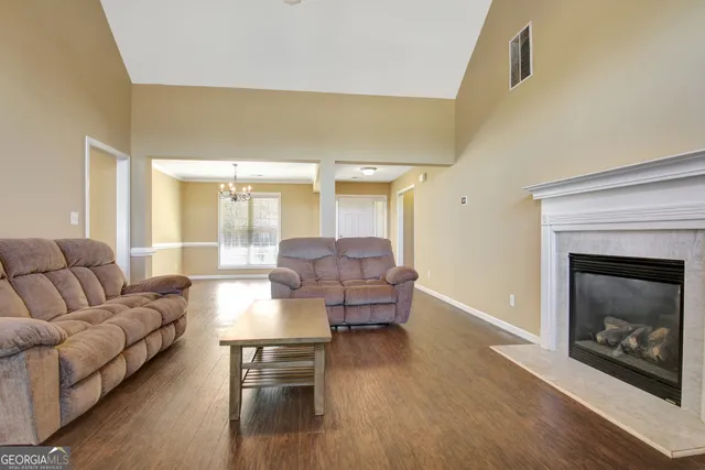 a view of a dining room with furniture and window