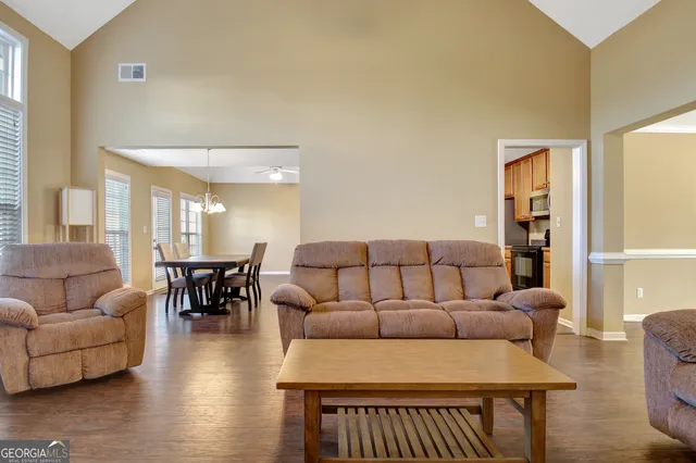 a view of workspace with wooden floor windows