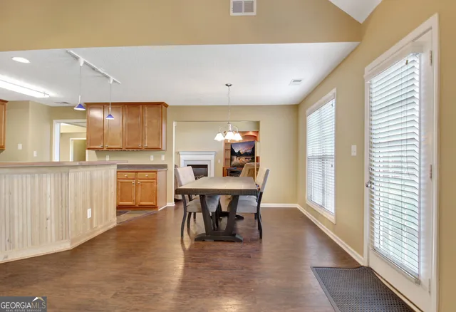 a kitchen with a sink stove and refrigerator