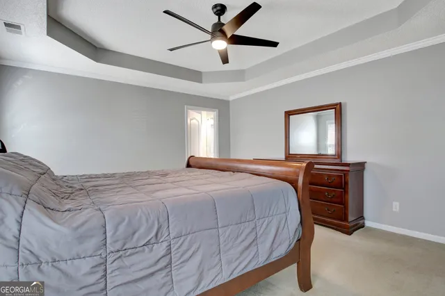 a spacious bathroom with a tub sink and mirror