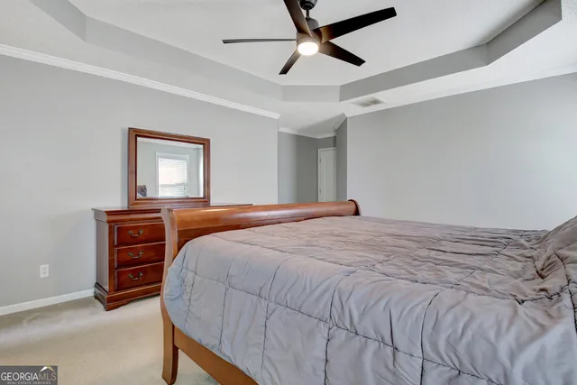 a bathroom with a granite countertop sink mirror and a bathtub