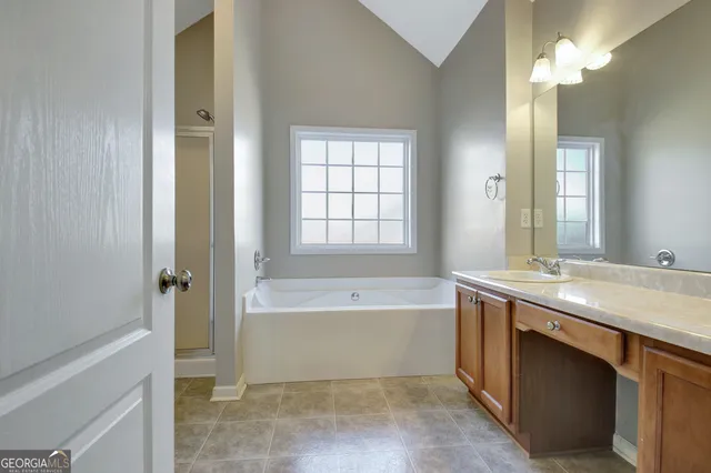 a white bath tub sitting next to a window