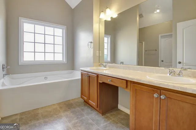 a view of a bathroom from a hallway