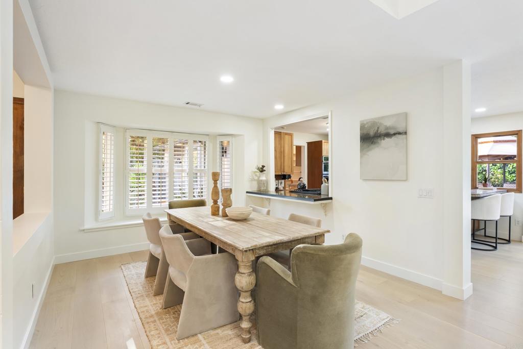 233 Cole Ranch Road Encinitas, CA 92024 - Photo 4 of 25 a view of a dining room with furniture and a table