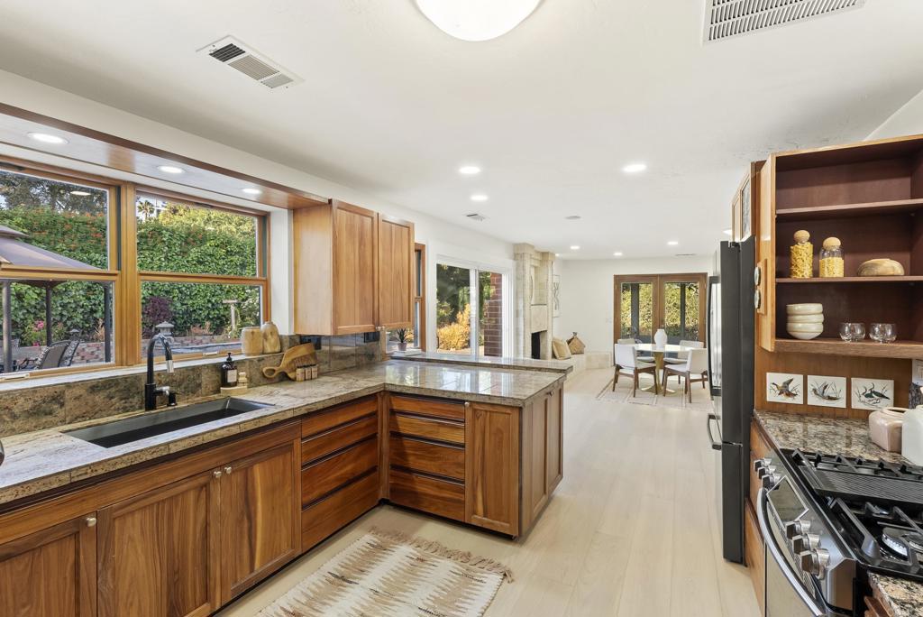 233 Cole Ranch Road Encinitas, CA 92024 - Photo 6 of 25 a large kitchen with lots of counter space and windows
