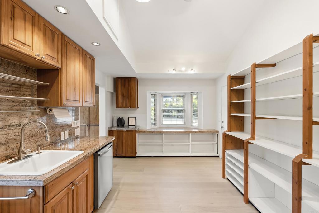 233 Cole Ranch Road Encinitas, CA 92024 - Photo 8 of 25 a kitchen with stainless steel appliances granite countertop a sink and cabinets