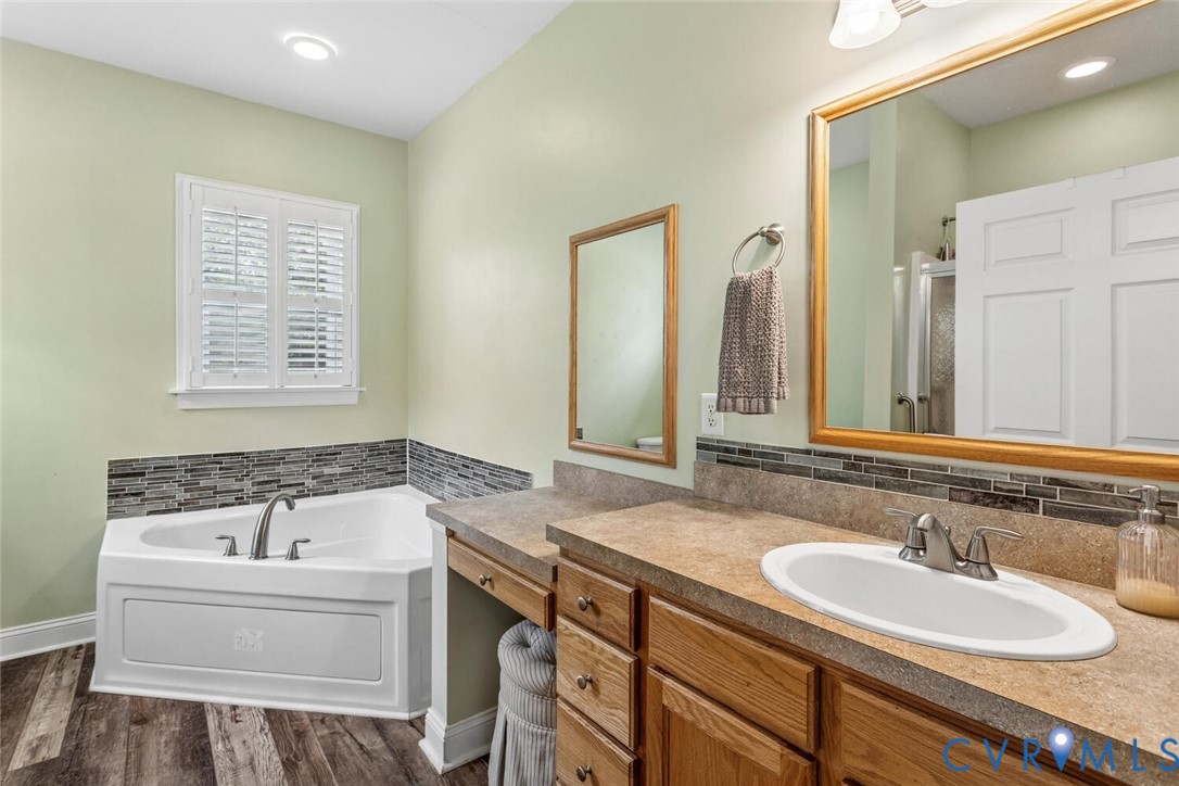 1875 Abbeyfield Road Maidens, VA 23102 - Photo 27 of 82 Primary bathroom, tub, sink and makeup vanity.