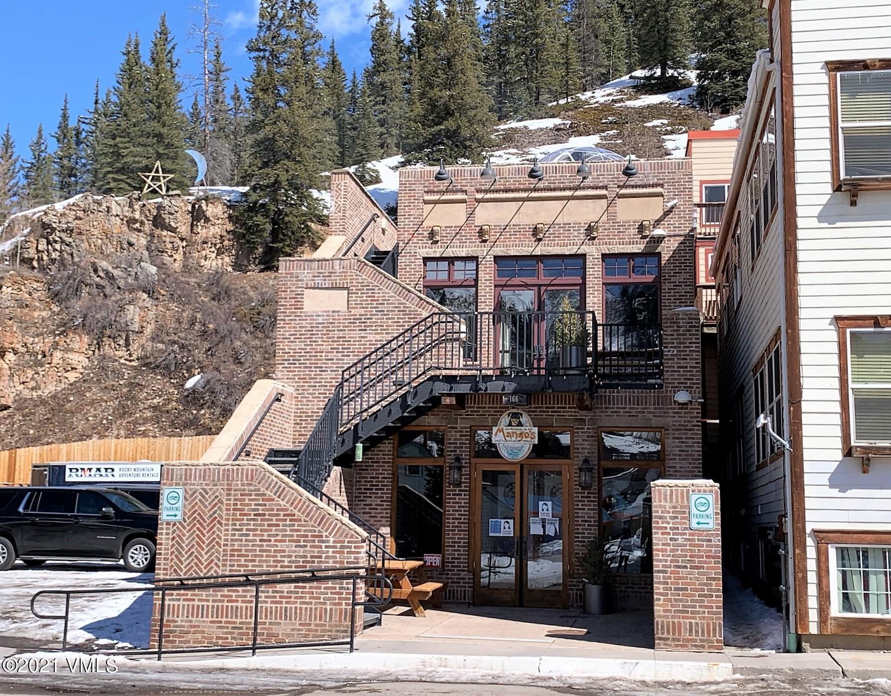 497 Eagle Street Red Cliff, CO 81649 - Photo 14 of 17 a view of a big building in front of retail shop