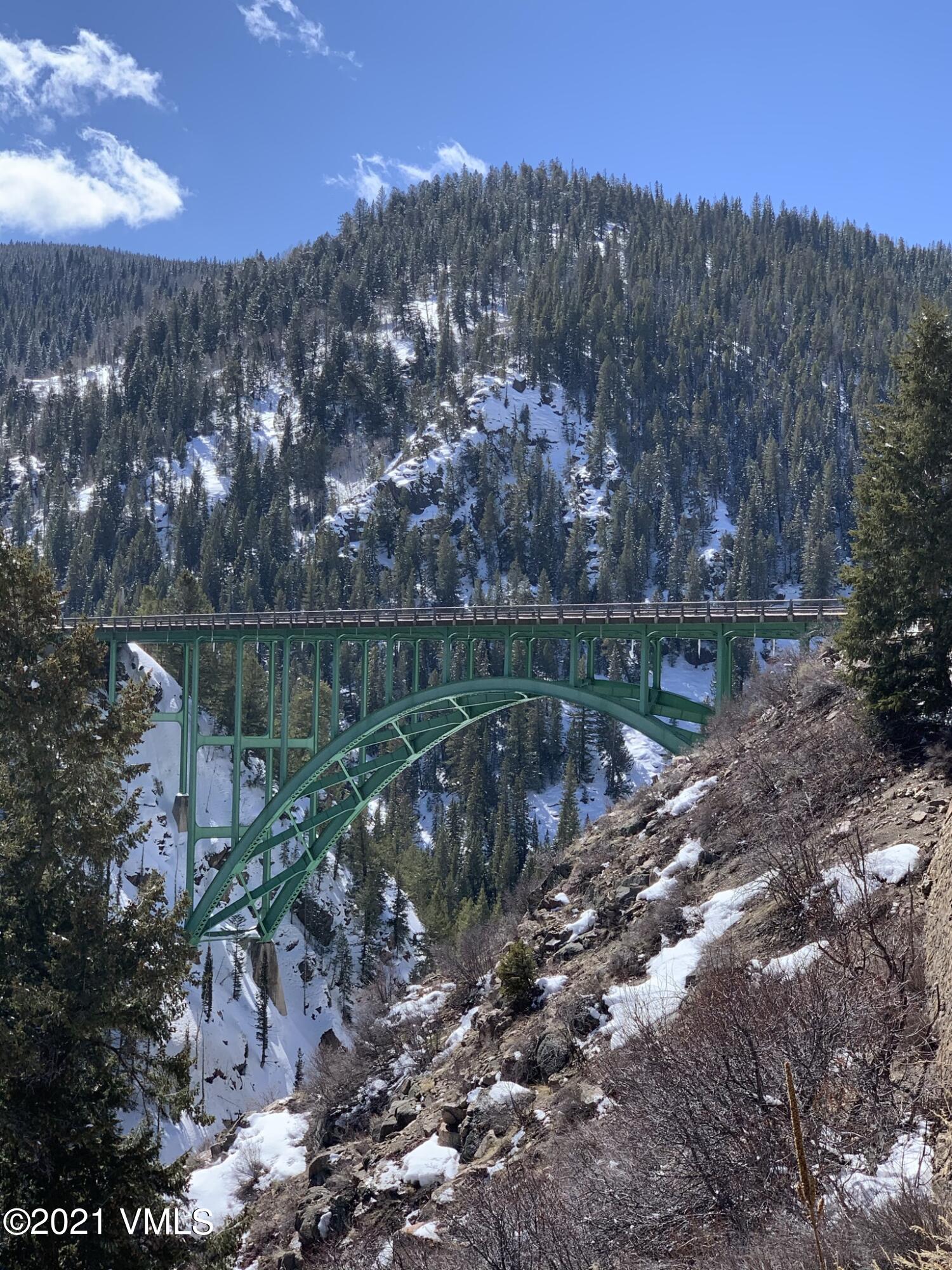 497 Eagle Street Red Cliff, CO 81649 - Photo 16 of 17 a view of a lake with a mountain in the background