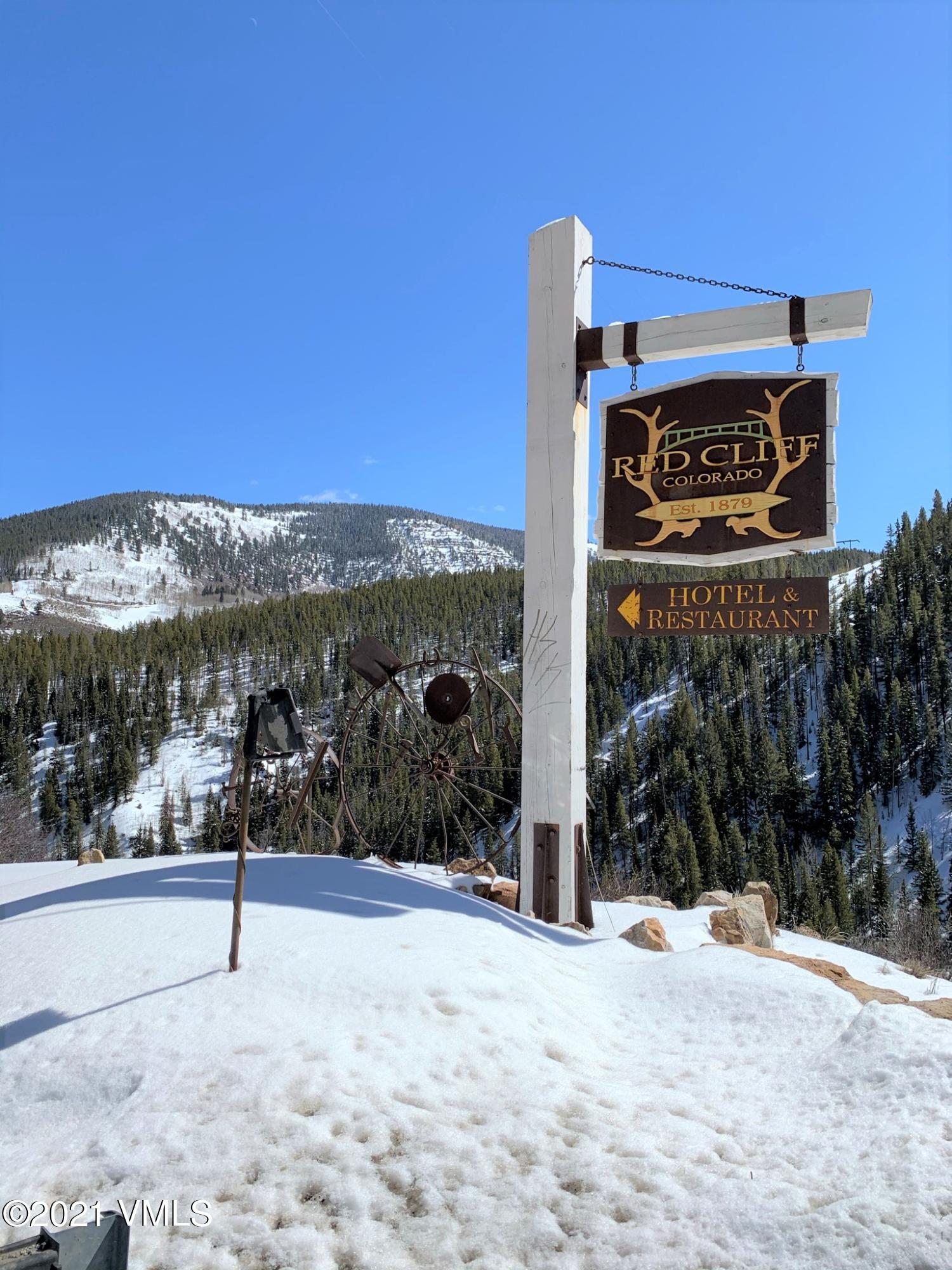 497 Eagle Street Red Cliff, CO 81649 - Photo 9 of 17 a view of a street with a building in the background