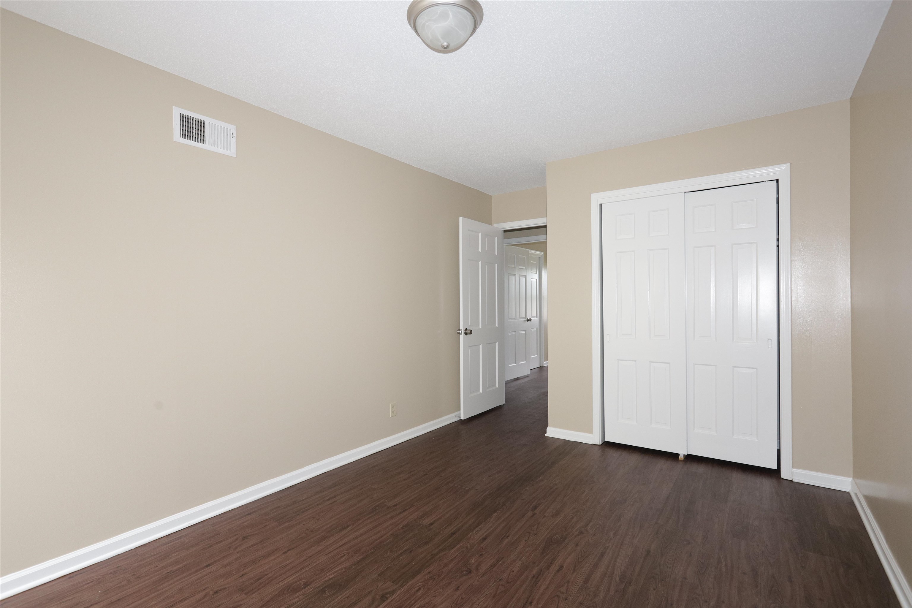 1812 Whitman Road Memphis, TN 38116 - Photo 13 of 18 a view of room with wooden floor