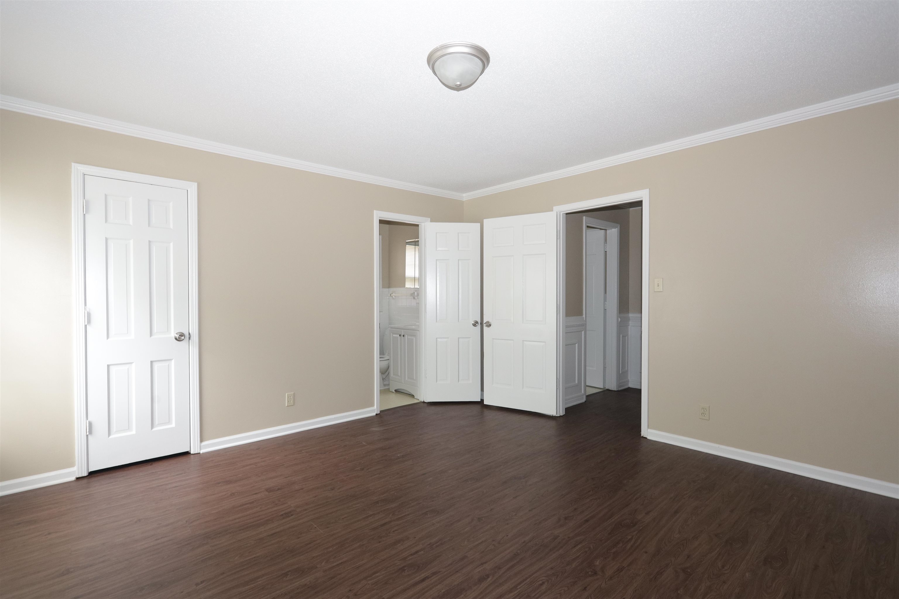 1812 Whitman Road Memphis, TN 38116 - Photo 14 of 18 a view of an empty room with wooden floor
