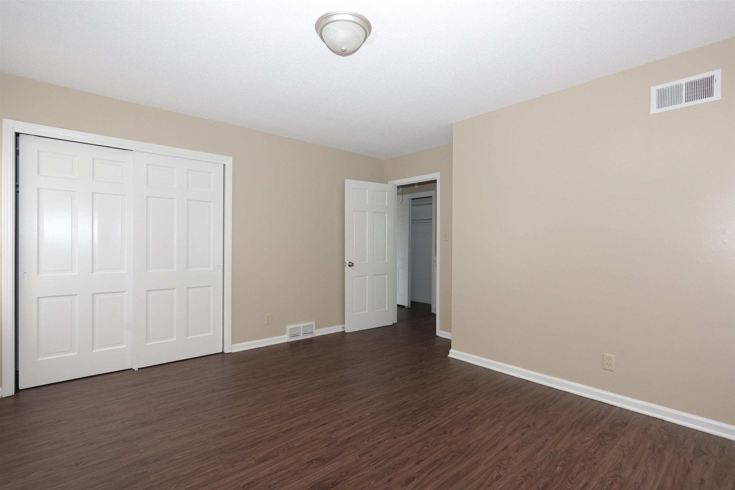1812 Whitman Road Memphis, TN 38116 - Photo 17 of 18 a view of an empty room with wooden floor