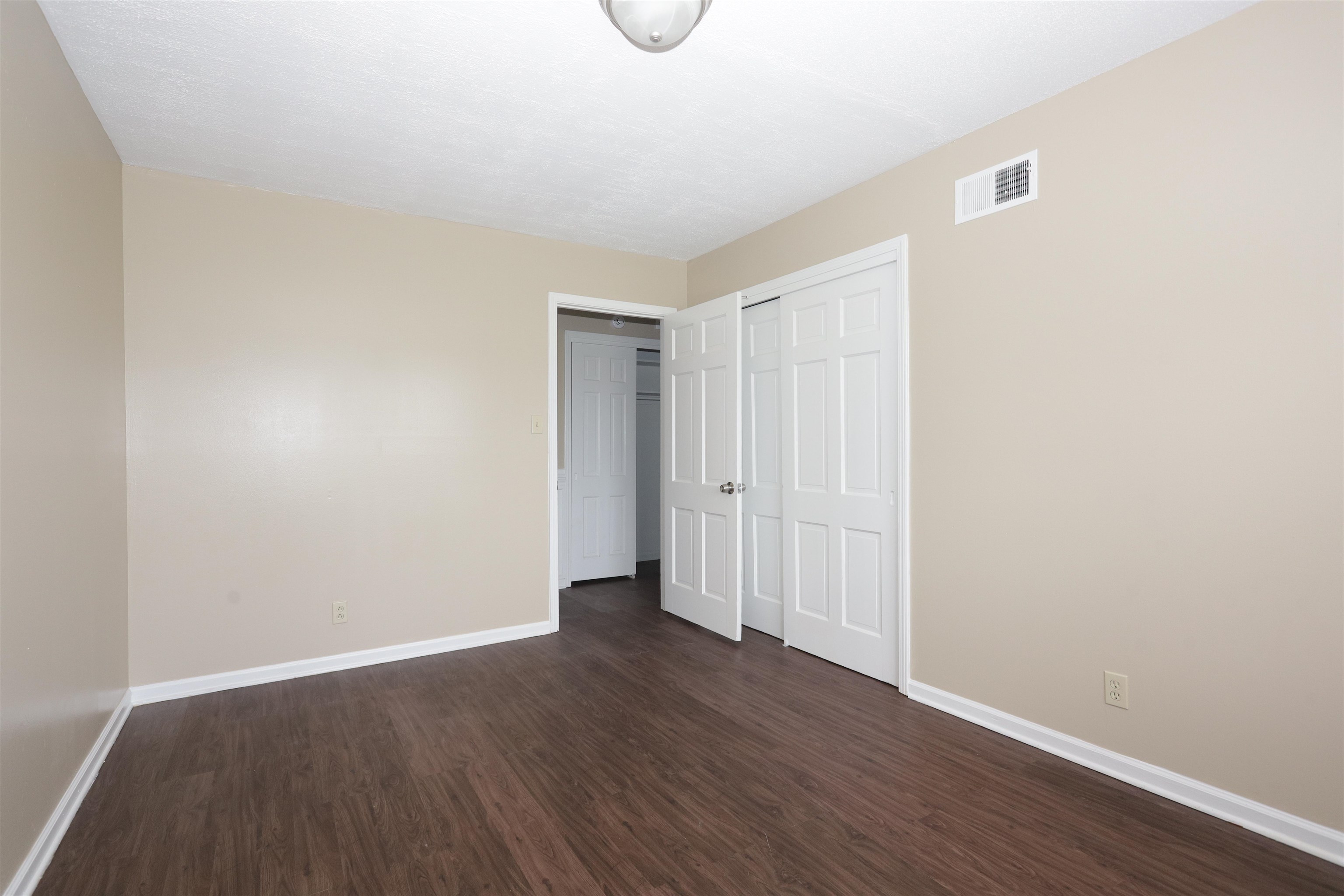 1812 Whitman Road Memphis, TN 38116 - Photo 18 of 18 a view of an empty room with wooden floor
