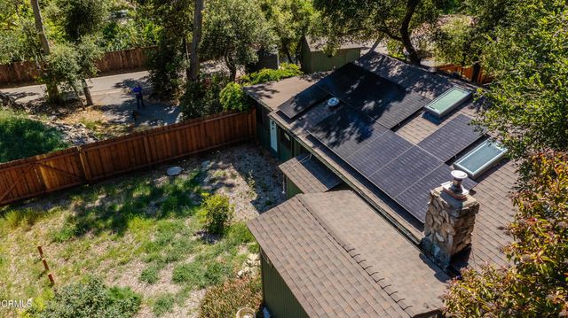 a view of a backyard with sitting area