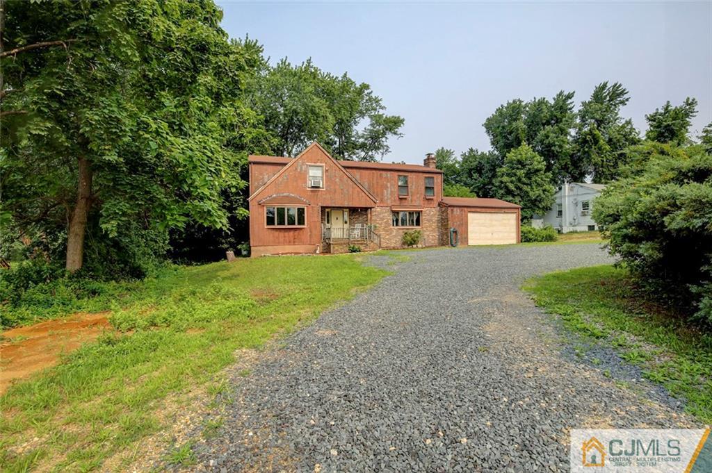22 Cottrell Road Old Bridge, NJ 07747 - Photo 32 of 32 a front view of a house with yard and green space