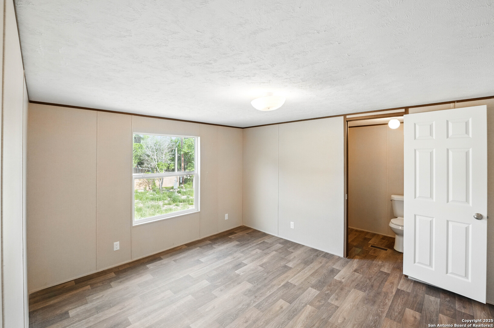 938 Covered Wagon Spring Branch, TX 78070 - Photo 11 of 20 an empty room with windows and closet